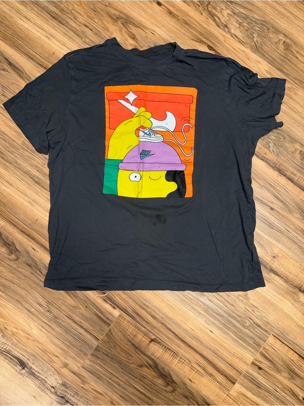 Nike Black Short-Sleeve Tee with Colorful Cartoon Sneaker Graphic